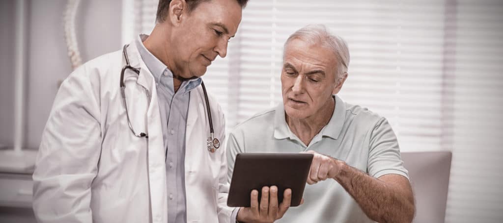 Man Discussing Cancer Treatment With His Doctor | Medicare Plan Finder