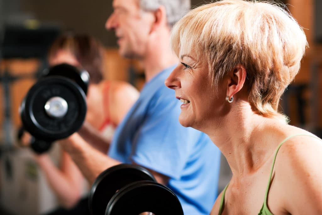 Healthy Seniors Lifting Dumbbells | Medicare Plan Finder